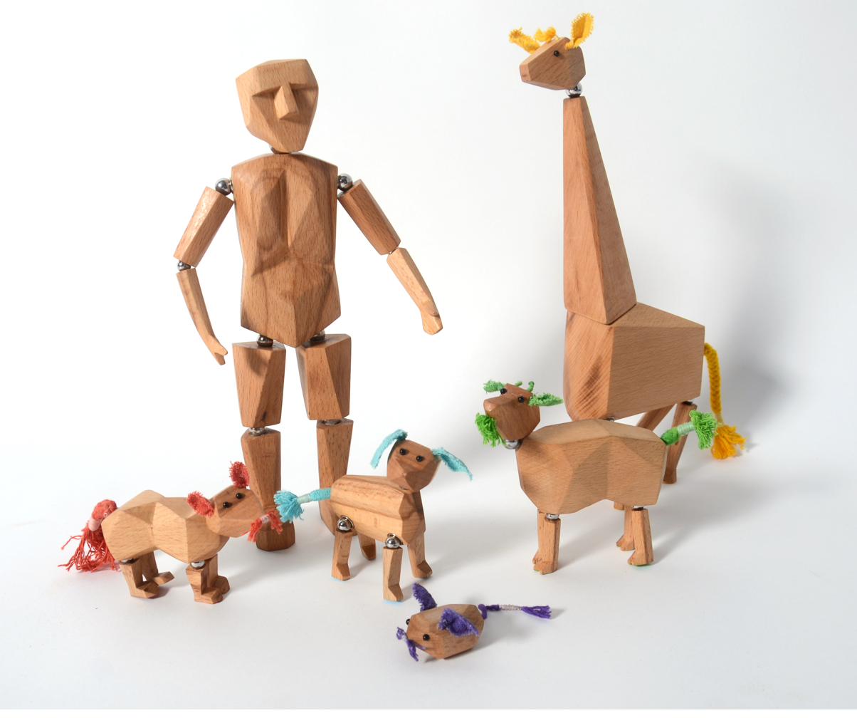 The full Dollybook cast - articulated wooden man with all animal friends gathered together