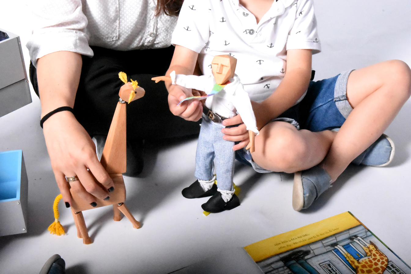 Children playing with Dollybook