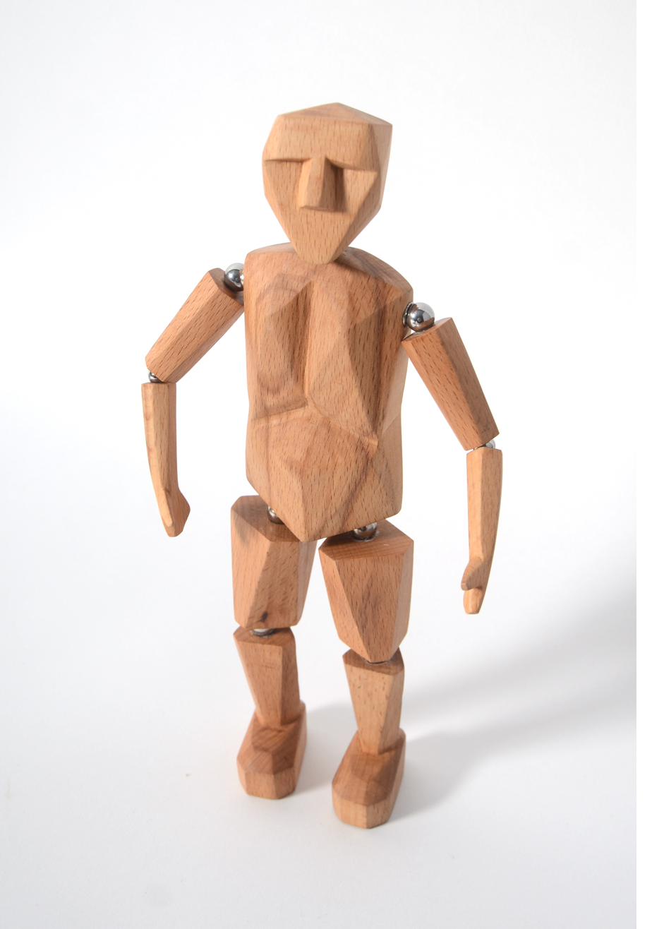 Fully articulated wooden man character with metal ball joints at shoulders, elbows, hips, and knees